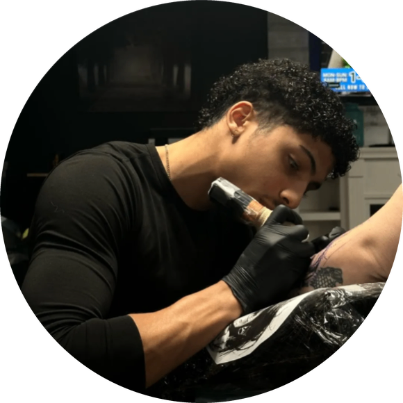 Nate tattooing a client at Main Street Ink Tattoos